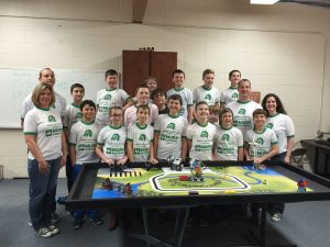 Lego® Robotics class members pose together during preparation for the showcase