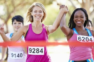 24489927 - two female runners finishing race together